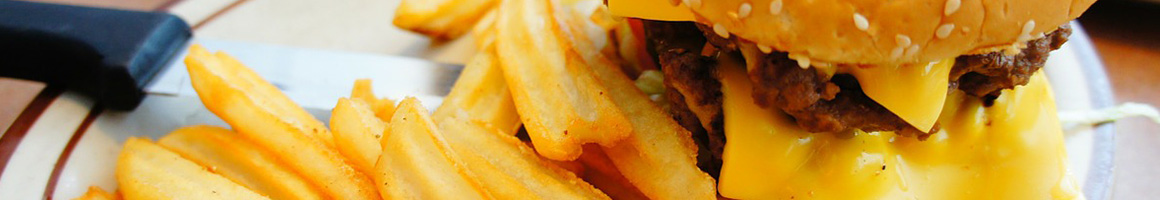 Eating Burger at Hippo Burgers restaurant in Humble, TX.